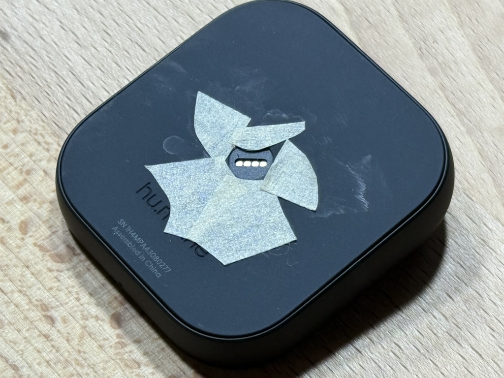 The moon sticker removed, exposing the connector pads